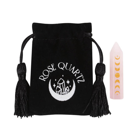 A black drawstring bag with the words Rose Quartz on, next to a Rose quartz wand.