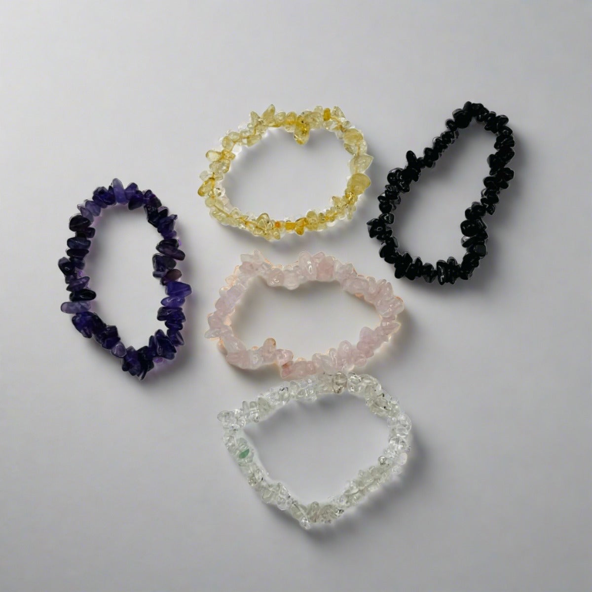 Five crystal chip bracelets featuring Amethyst, Citrine, Black Tourmaline, Rose Quartz and Quartz.