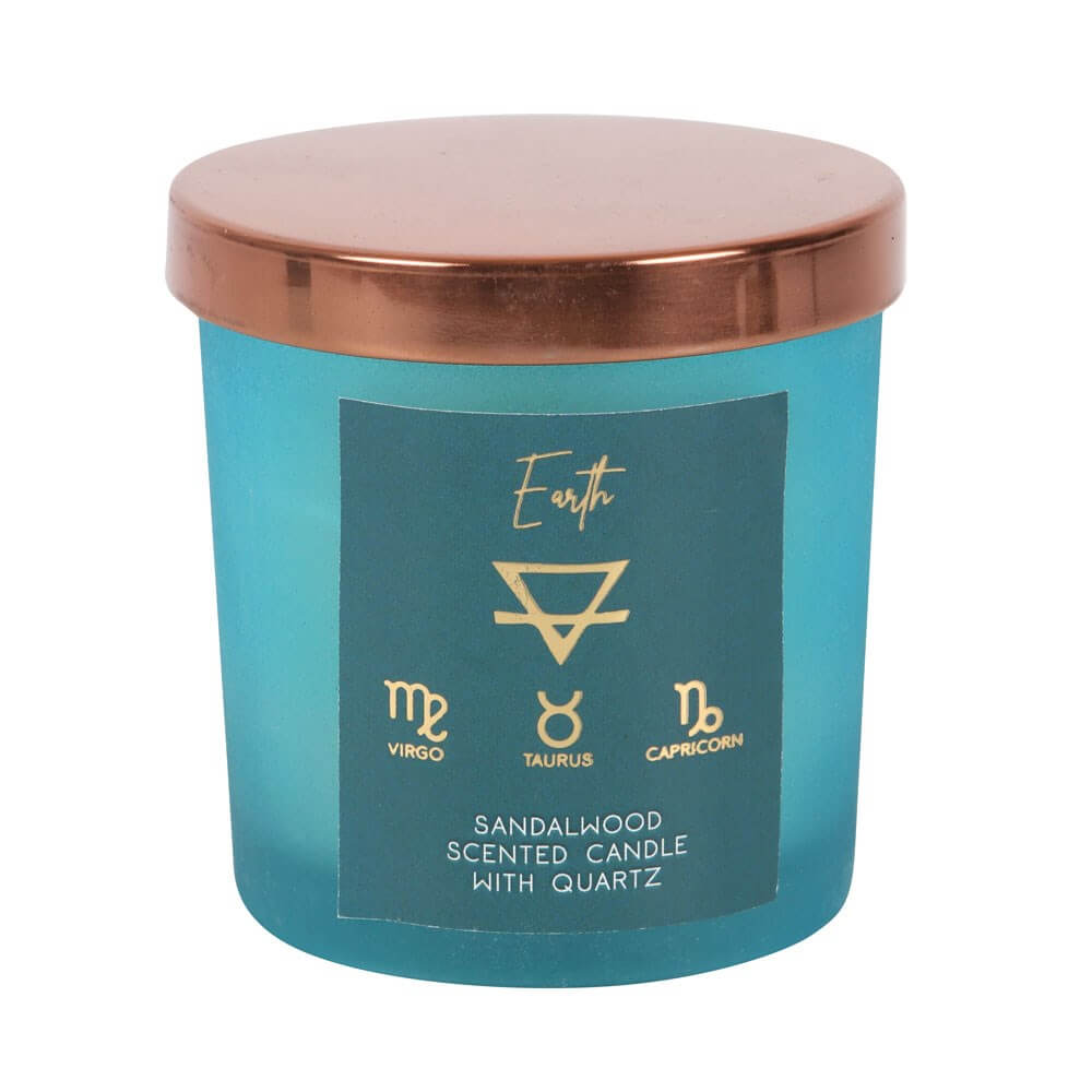 A light blue candle in a jar that has a gold lid. The label says: Earth, Virgo, Taurus, Capricorn, Sandalwood scented.