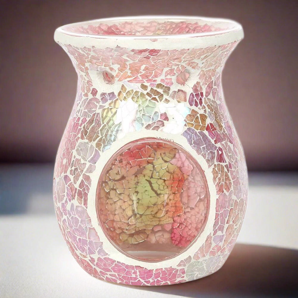 A front view of a large and glistening pink crackle effect oil and wax melt candle burner.