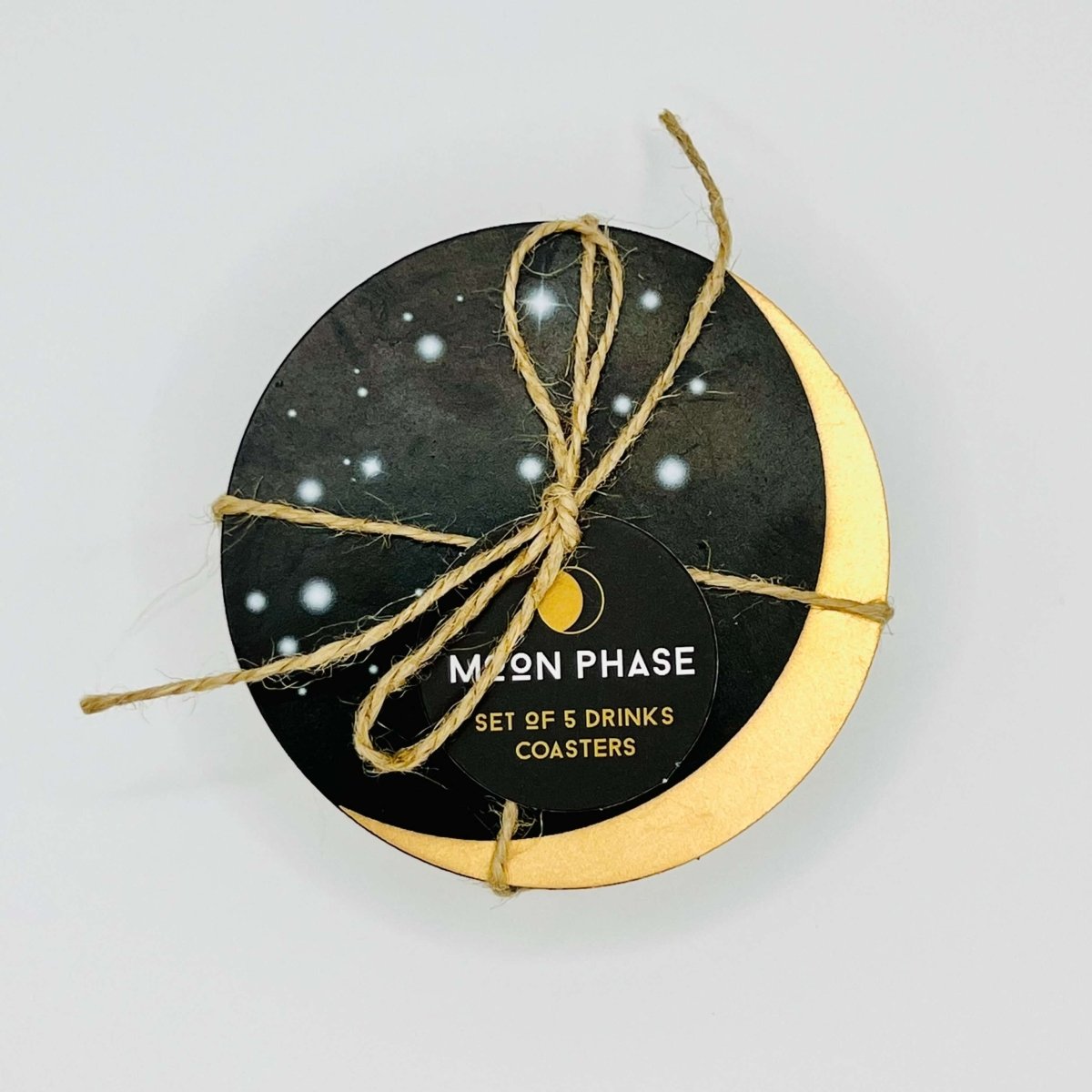 A top view of five coasters tied together with brown string and a label saying Moon Phase, set of five drinks coasters.