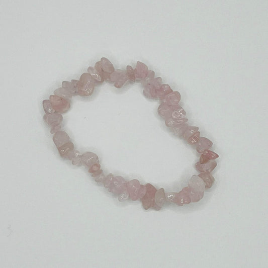 A pink Rose Quartz crystal chip bracelet. The crystal chips are different sizes.